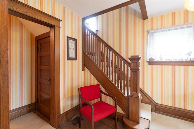 stairs with visible vents and baseboards