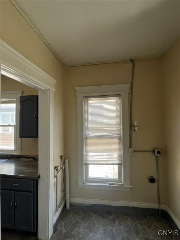 entryway featuring baseboards