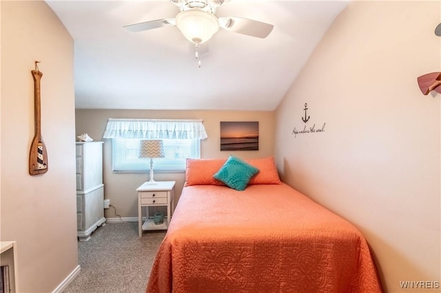 bedroom featuring a ceiling fan, vaulted ceiling, carpet, and baseboards