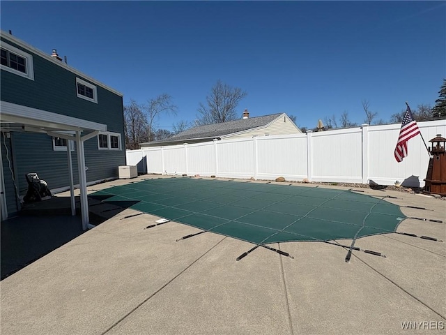 view of swimming pool with a patio, a fenced in pool, and a fenced backyard