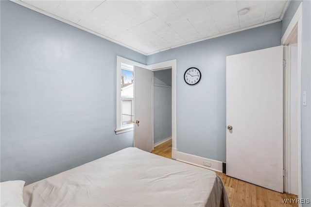bedroom with light wood-style floors