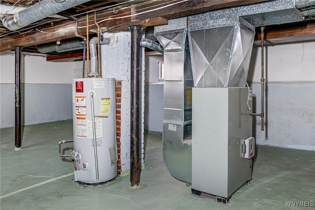 utility room with heating unit and water heater