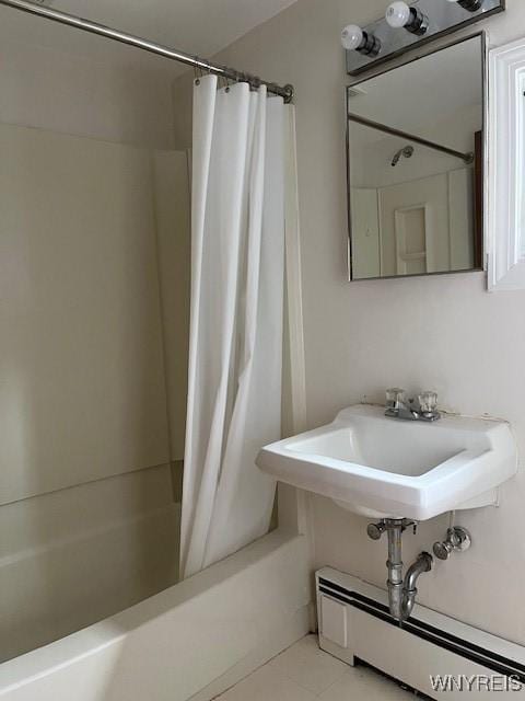 full bathroom featuring shower / bath combination with curtain, tile patterned flooring, and a baseboard radiator