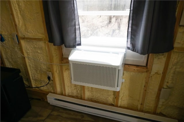 utility room with a baseboard radiator