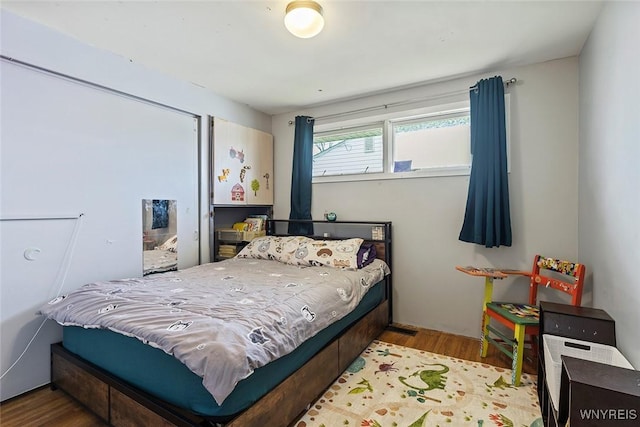 bedroom with wood finished floors
