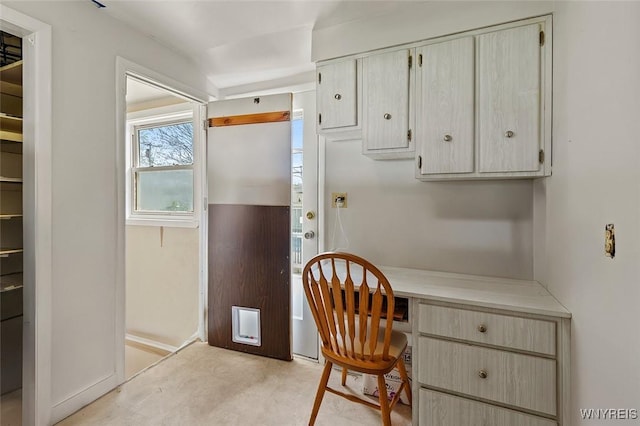 office area with baseboards and built in desk