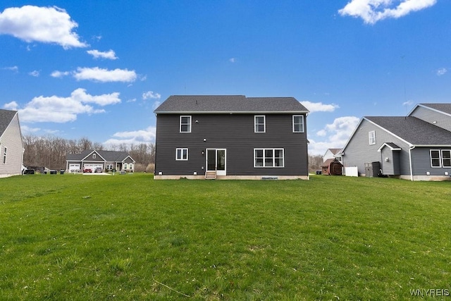 back of house featuring a patio area and a yard