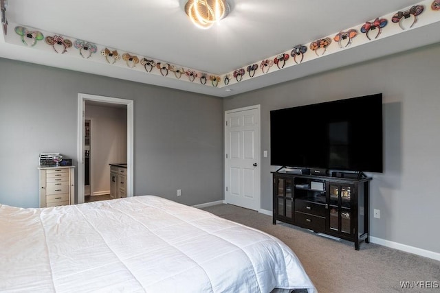 carpeted bedroom with baseboards