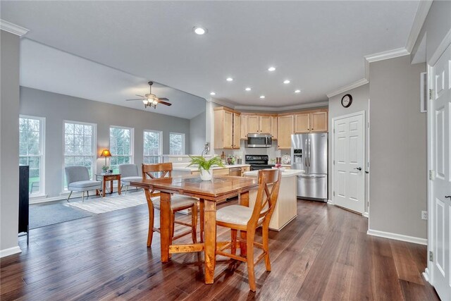 dining area with crown molding, recessed lighting, dark wood-style floors, and baseboards