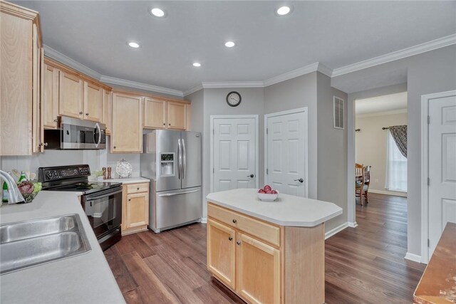kitchen with a sink, stainless steel appliances, light brown cabinets, crown molding, and dark wood finished floors