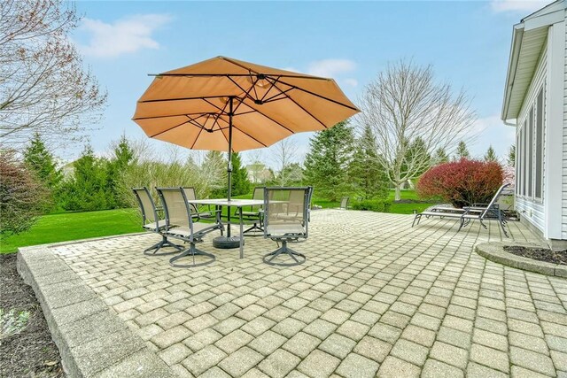 view of patio featuring outdoor dining area