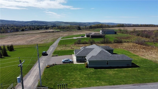 birds eye view of property with a rural view