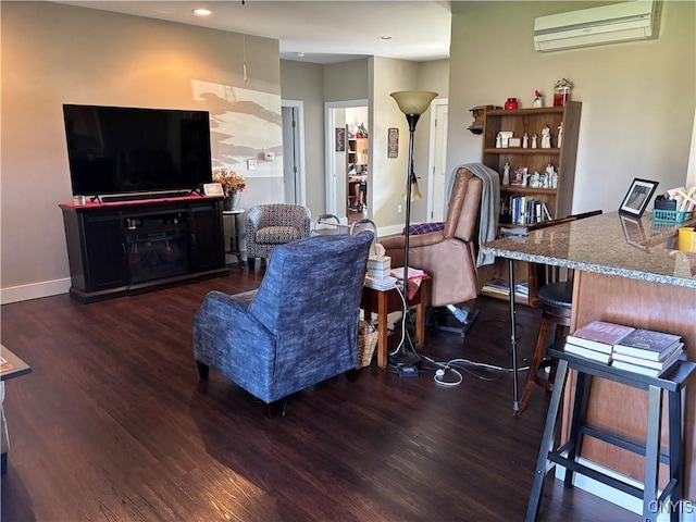 living room featuring wood finished floors, recessed lighting, a wall mounted AC, and baseboards