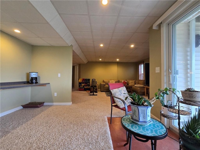 interior space with recessed lighting, a paneled ceiling, carpet, and baseboards