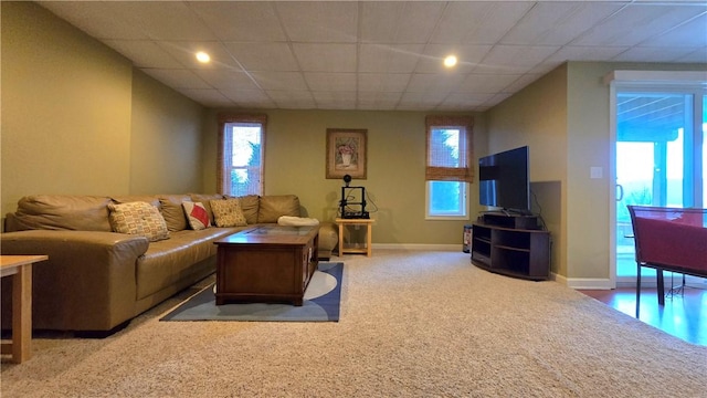 living area featuring recessed lighting, carpet flooring, baseboards, and plenty of natural light