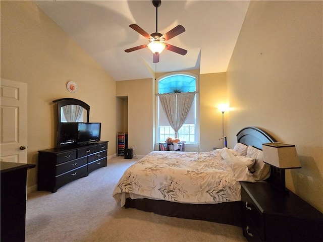 bedroom with high vaulted ceiling, ceiling fan, and carpet