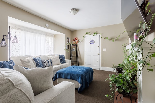 living area with baseboards and carpet