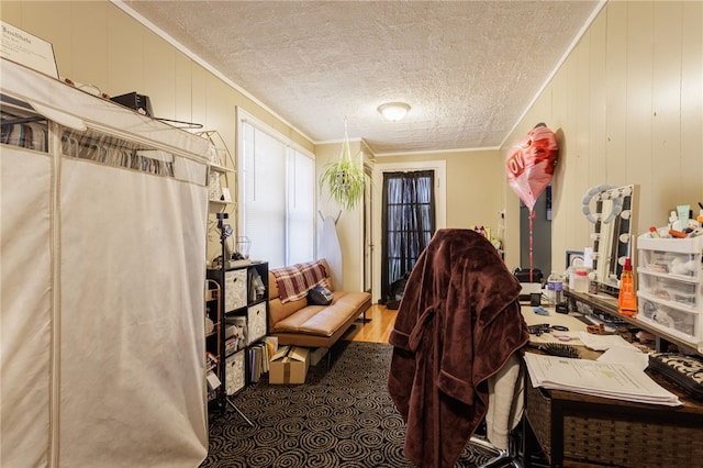 office featuring wood finished floors and ornamental molding