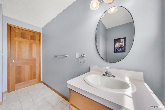 bathroom featuring vanity and baseboards