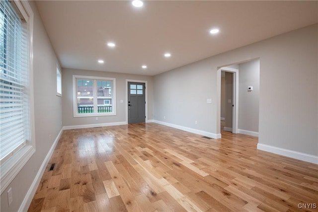 entrance foyer with visible vents, recessed lighting, light wood finished floors, and baseboards