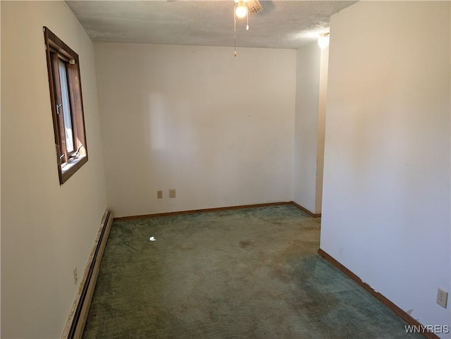 carpeted spare room with baseboards and a baseboard radiator