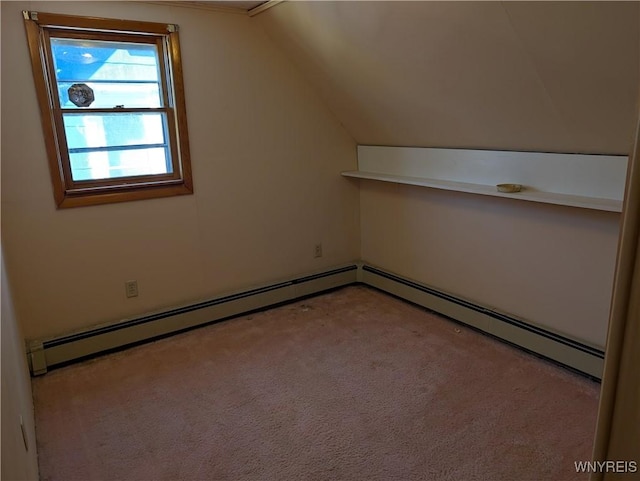 additional living space featuring baseboard heating, carpet floors, and lofted ceiling