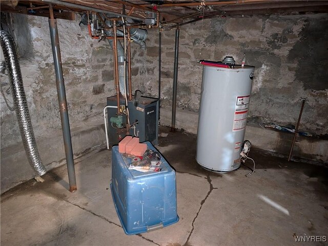 utility room with gas water heater and a heating unit