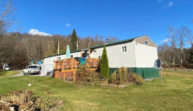 846-848 Silas Tompkins Rd, Hancock, NY 12760 - view of side of property featuring a lawn and a wooden deck