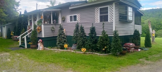 846-848 Silas Tompkins Rd, Hancock, NY 12760 - view of property exterior featuring a lawn