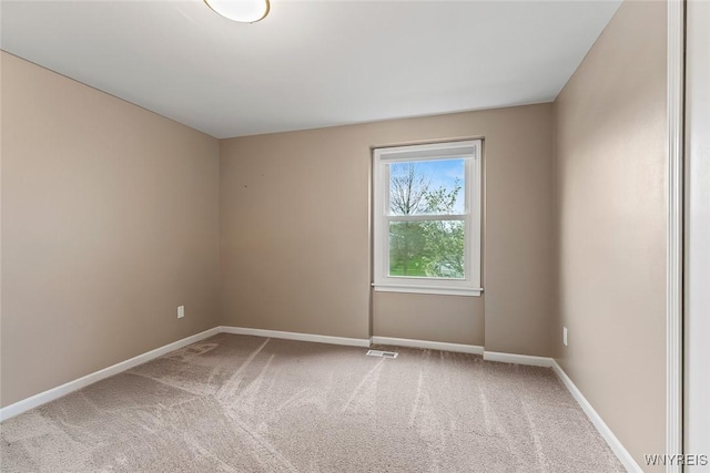 65 Guilford Ln Unit 5, Amherst, NY 14221 - empty room with visible vents, carpet, and baseboards