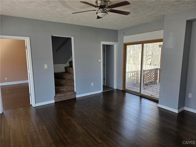 4844 Onondaga Rd, Onondaga, NY 13215 - interior space featuring a textured ceiling, stairway, ceiling fan, baseboards, and dark wood finished floors