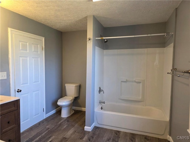 4844 Onondaga Rd, Onondaga, NY 13215 - bathroom with wood finished floors, toilet, a textured ceiling, and  shower combination
