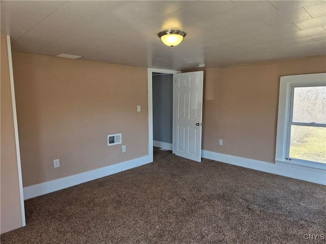4844 Onondaga Rd, Onondaga, NY 13215 - unfurnished room featuring dark carpet, visible vents, and baseboards