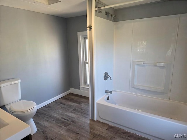 4844 Onondaga Rd, Onondaga, NY 13215 - bathroom featuring baseboards, toilet, wood finished floors, vanity, and  shower combination
