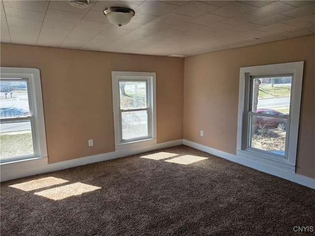 4844 Onondaga Rd, Onondaga, NY 13215 - carpeted spare room featuring baseboards and plenty of natural light