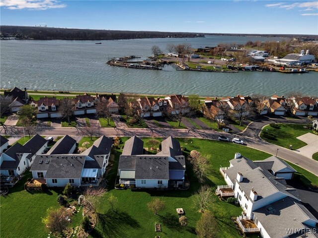 birds eye view of property with a residential view and a water view