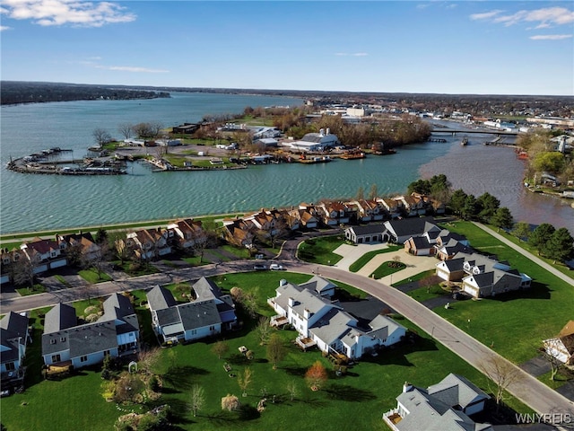 bird's eye view with a water view and a residential view
