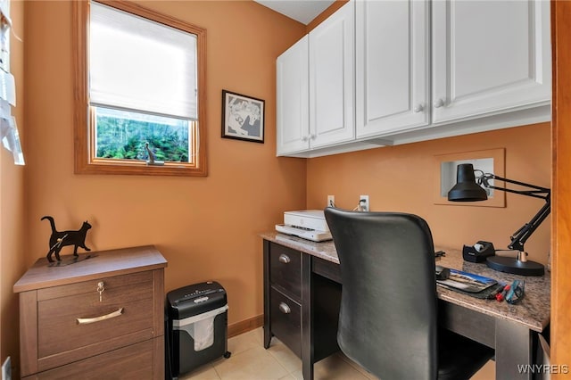 office space featuring light tile patterned flooring and baseboards