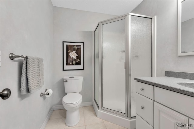 full bath featuring tile patterned flooring, a shower stall, toilet, vanity, and baseboards