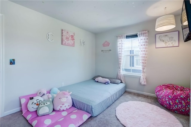 bedroom featuring carpet flooring and baseboards