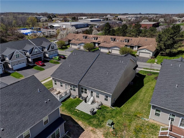 birds eye view of property with a residential view