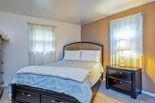 carpeted bedroom featuring baseboards