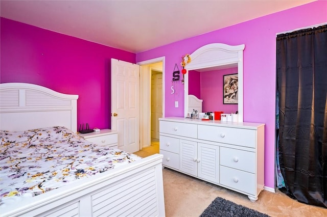 bedroom with light colored carpet