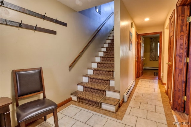 stairway featuring recessed lighting, tile patterned flooring, baseboards, and a baseboard radiator