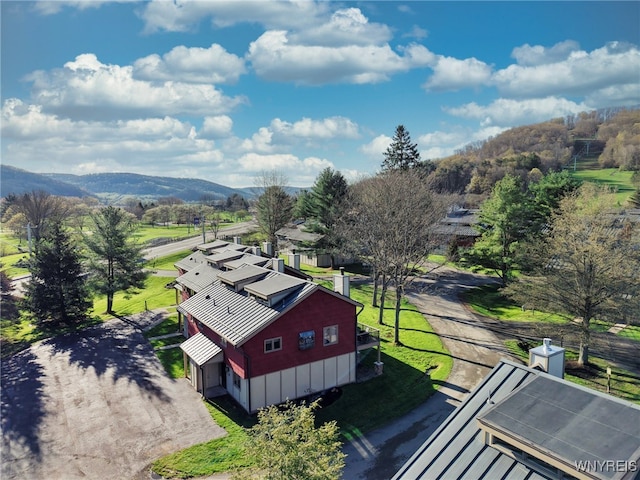 birds eye view of property featuring a mountain view
