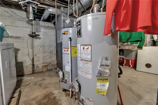 utilities featuring gas water heater and washer / dryer