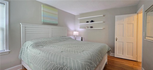 bedroom featuring wood finished floors