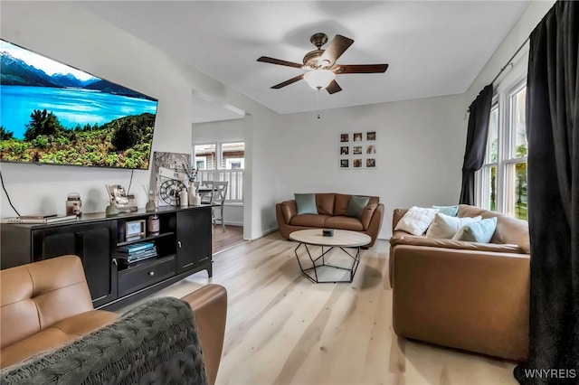 living area featuring ceiling fan and light wood-style flooring