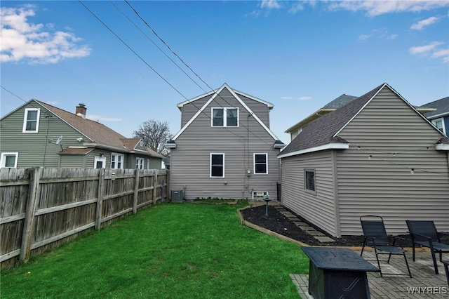back of house featuring cooling unit, a lawn, a patio area, and fence
