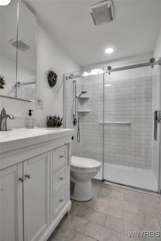 bathroom featuring recessed lighting, a shower stall, vanity, toilet, and visible vents